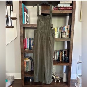 Cider overalls with the bib and open back.